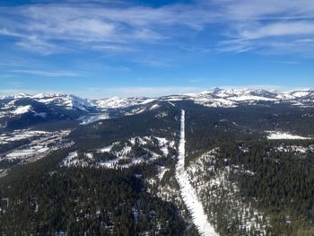 Scenic view of snow covered mountains against sky