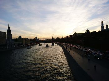 View of bridge over river against buildings in city