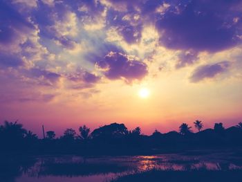 Scenic view of sea against romantic sky at sunset