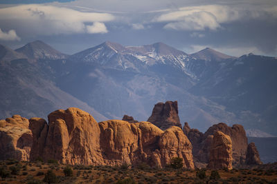 Canyon with snowy mountains on back in utah arches national park