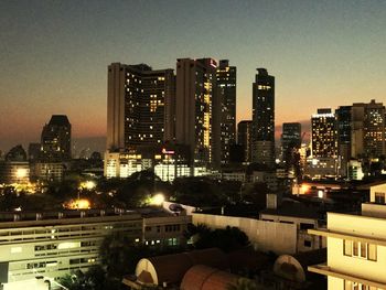 High angle view of city lit up at night