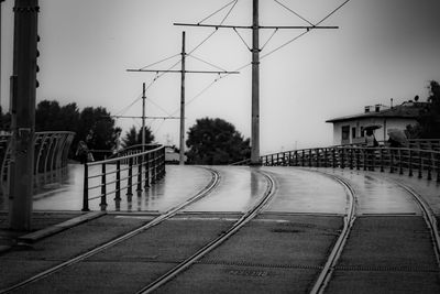 Tramway in city against clear sky