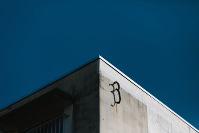 Low angle view of building against blue sky