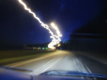 Car moving on road at night