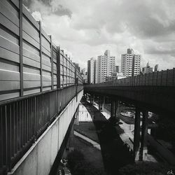 View of bridge against cloudy sky