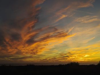 Scenic view of dramatic sky during sunset