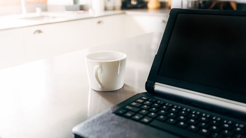 Close-up of coffee cup on table