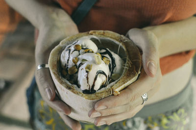 Close-up of woman holding coconut ice cream thailand