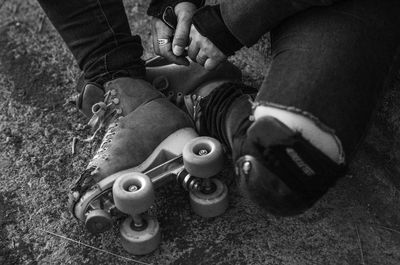 Low section of man standing on street