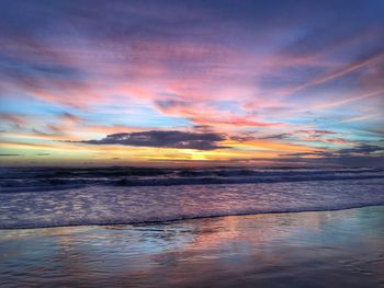 Scenic view of sea against dramatic sky