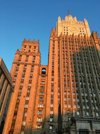 Low angle view of building against blue sky