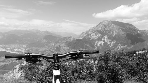 Bicycle on mountain against sky