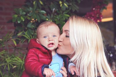 Portrait of mother and daughter outdoors