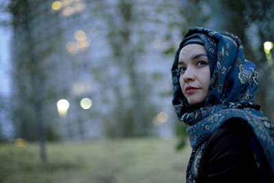 Portrait of woman looking away in winter