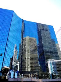 Low angle view of skyscrapers against clear sky