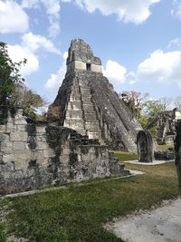 View of old ruin building against cloudy sky