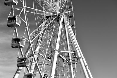 Low angle view of ferris wheel against sky