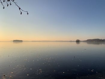 Scenic view of lake against sky during sunset