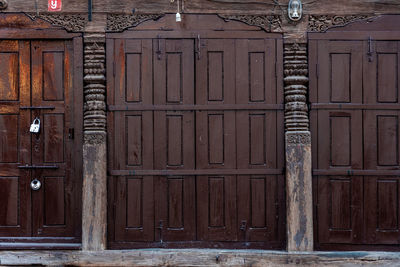 Closed wooden door of old building
