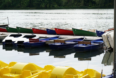 Close-up of multi colored boats moored in lake