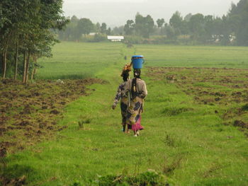 Full length of man on field against sky