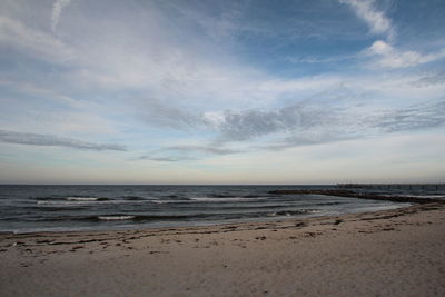 Scenic view of beach against sky