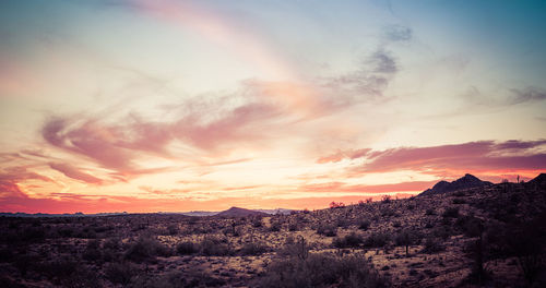 Scenic view of landscape against sky during sunset