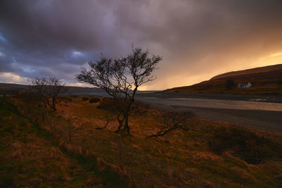 Scenic view of landscape against cloudy sky