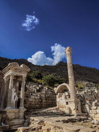 Old ruins of temple against blue sky