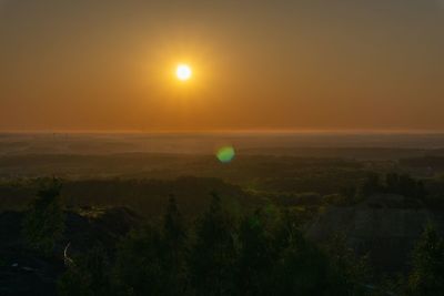 Scenic view of landscape against sky during sunset