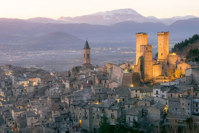 Aerial view of townscape against sky in city