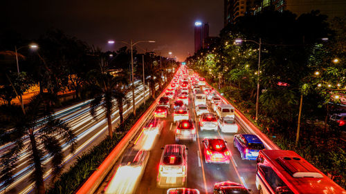 High angle view of light trails on city street at night