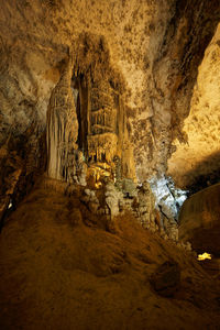 Low angle view of illuminated cave