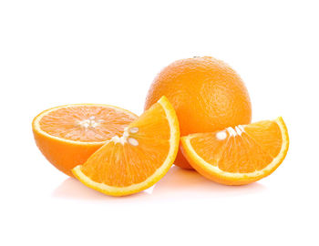 Close-up of orange fruit against white background