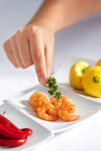 Cropped hand of man holding food