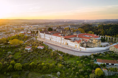 Aerial drone view of convento de cristo christ convent in tomar at sunrise, portugal