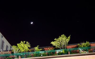 View of illuminated street lights at night