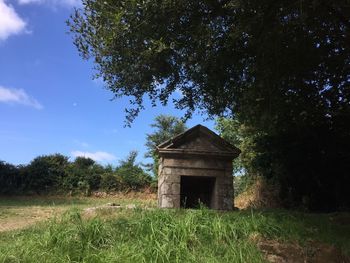 House on field against sky