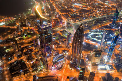 High angle view of illuminated city buildings at night