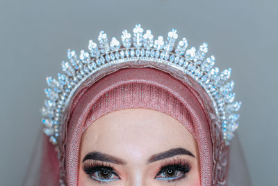 Close-up of woman wearing crown