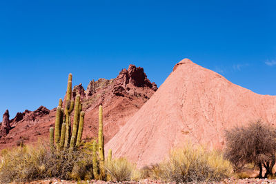 Scenic view of land against clear blue sky