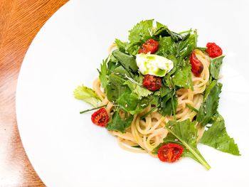 High angle view of fruits in plate on table