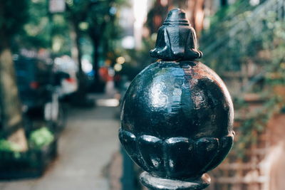 Close-up of old light bulb on street