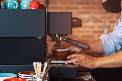 Man working with coffee in cafe