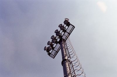 Low angle view of communications tower against sky