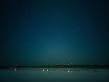 Illuminated sea at night
