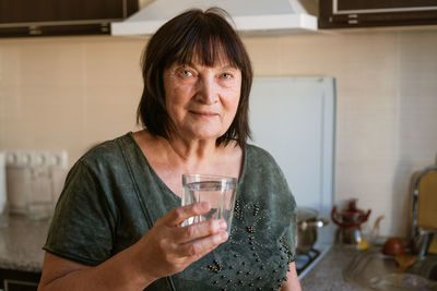 Young woman drinking glass