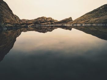 Scenic view of calm lake with reflection against sky