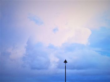 Low angle view of street light against sky