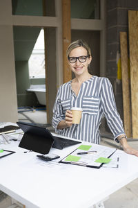 Portrait of young businesswoman working at office